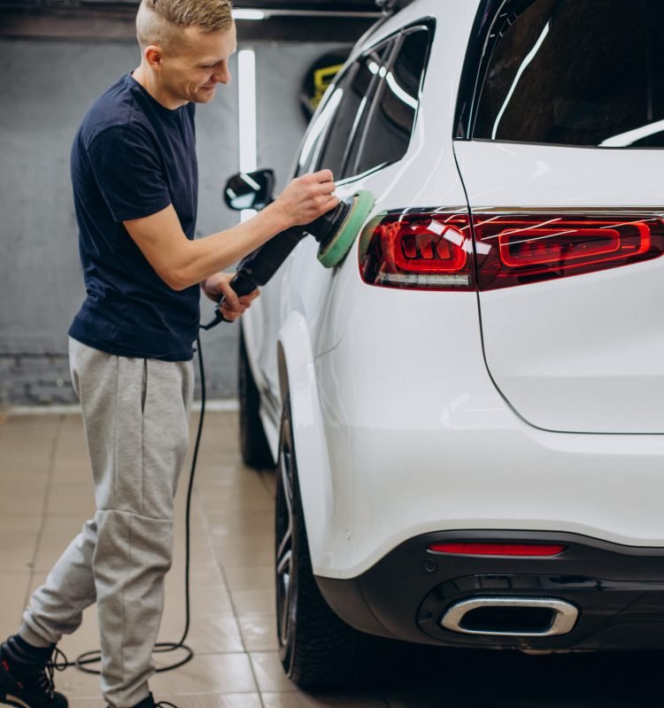 Man polishing car with orbital applicator
